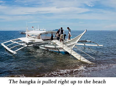 The bangka is pulled right up to the beach