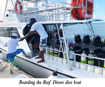 Boarding the Reef Divers dive boat